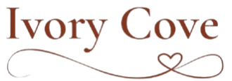 Logo of Ivory Cove with a decorative heart symbol on a white background